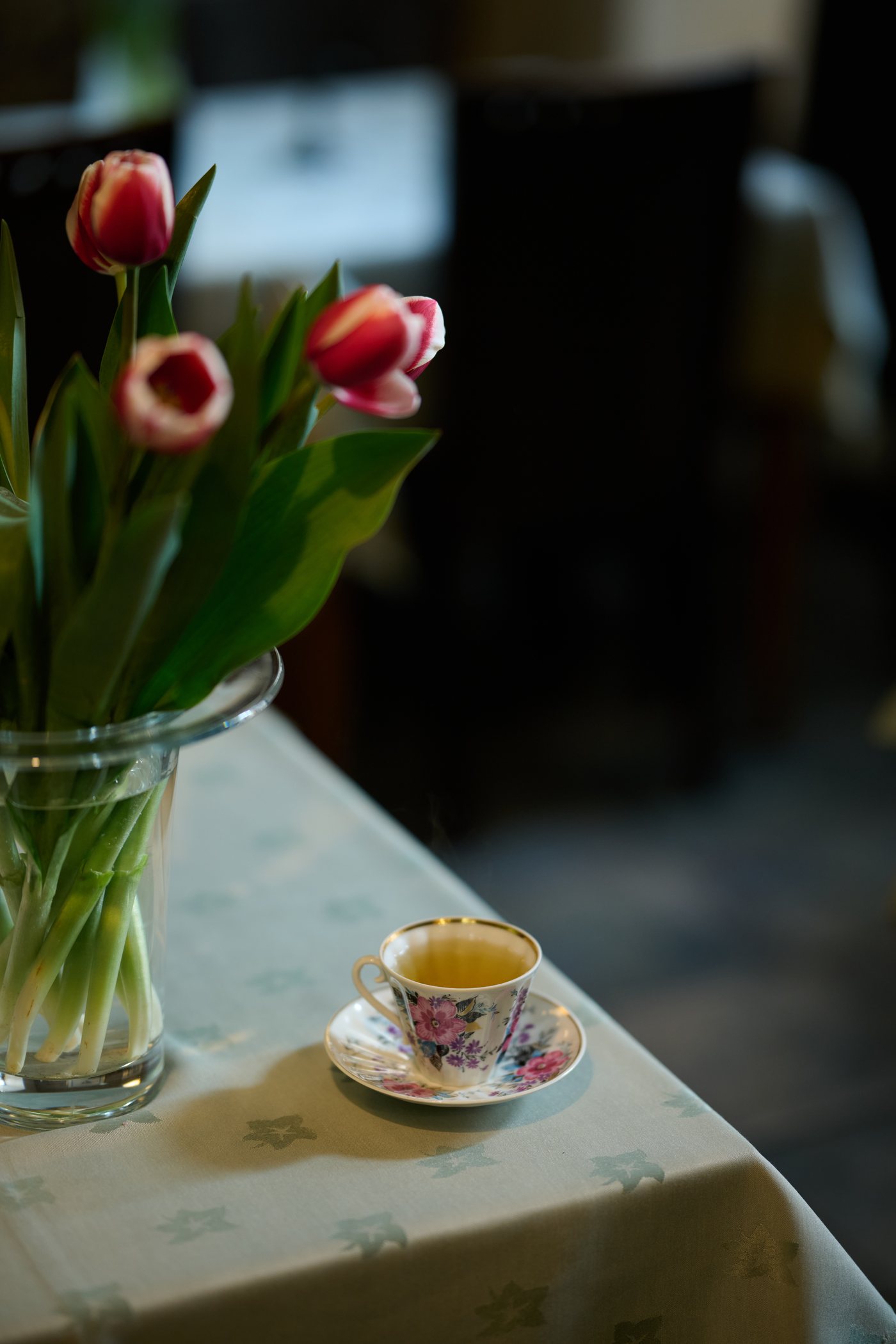 Armenian coffee cup beside fresh tulips